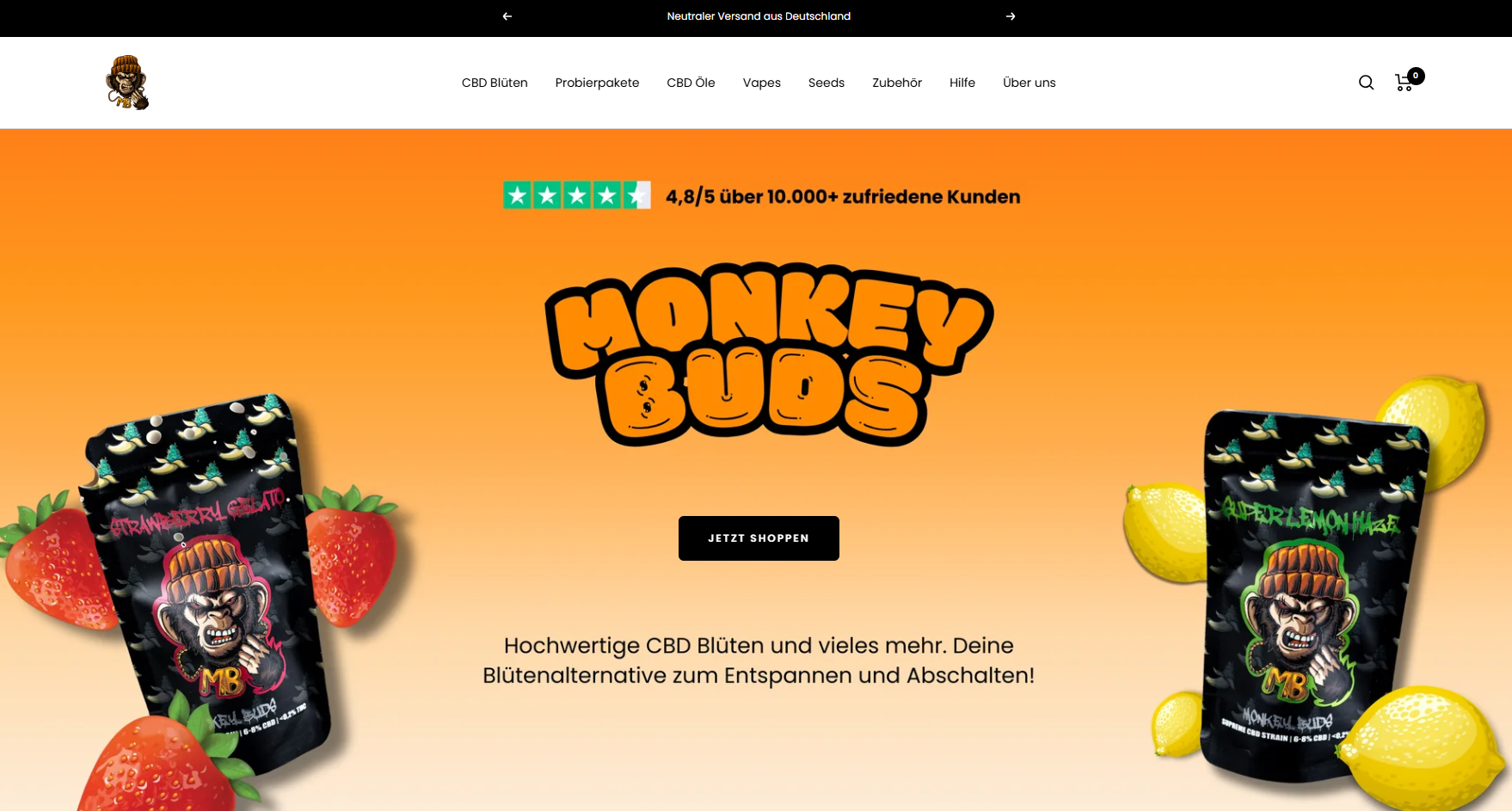 Screenshot der MonkeyBuds Startseite mit orangem Banner, zwei Blütenbeuteln sowie Erdbeeren und Zitronen als Fruchtmotiv