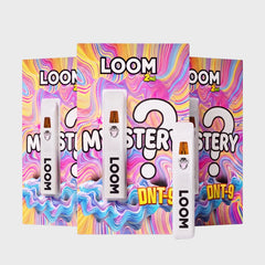 Drei Loom DNT-9 Mystery Verpackungen mit weißen Vapes davor